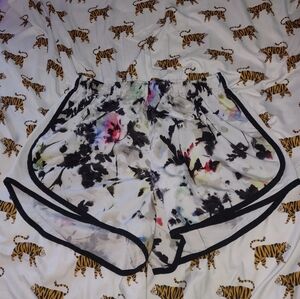 white dri fit shorts with colorful design from nike size large no flaws